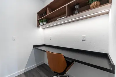 a desk in a room with a chair at Family 3BR Home Minutes from Disney in Kissimmee