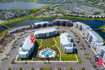an aerial view of a parking lot with buildings at Condo near Disney with Resort in Kissimmee