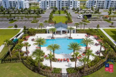 an aerial view of a pool at a resort at Stunning Condo in the Heart of Orlando in Kissimmee