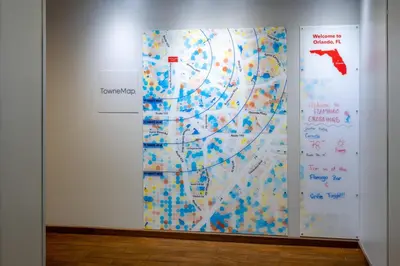 a wall with a painting of a map on it at TownePlace Suites Orlando at FLAMINGO CROSSINGS Town Center, Western Entrance in Orlando