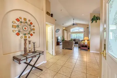 a hallway of a home with a tile floor at Safari Lodge in Orlando
