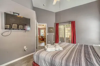 a bedroom with a bed with two towels at Pool Paradise in Orlando