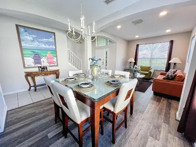 a dining room with a table and chairs at Island Paradise in Kissimmee