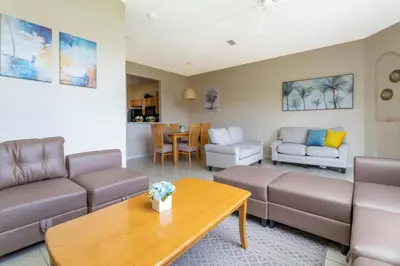 a living room with a couch and a table at Central House Near Disney in Orlando