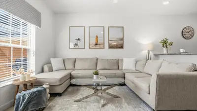 a living room with a couch and a table at Family Resort Getaway w Pool & Patio near Disney in Kissimmee