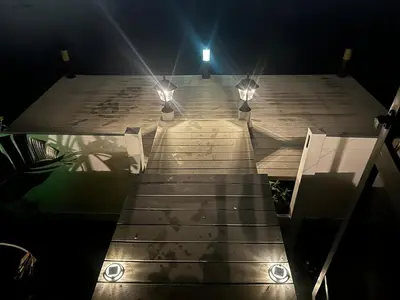 a set of wooden steps with lights on top at Orlando Lakefront Pool Villa 25 min Disney & Univ in Orlando