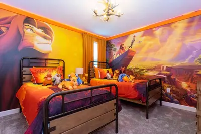 a bedroom with two beds with stuffed animals on them at Brand New 9 Bedroom Single Family Storey Lake 18ST in Kissimmee