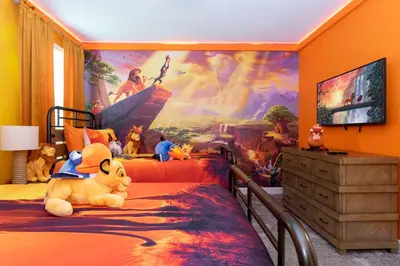 a bedroom with a disney mural on the wall at Brand New 9 Bedroom Single Family Storey Lake 18ST in Kissimmee