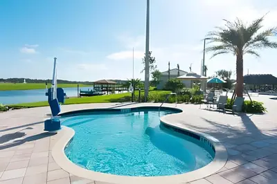 a swimming pool at a resort with a resort at Casa 5Q c/ Piscina Sul e Game Room – Storey Lake in Kissimmee
