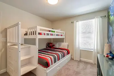 a white bunk bed in a childs bedroom at Casa 6Q c/ Piscina + Temas Disney – Storey Lake in Kissimmee