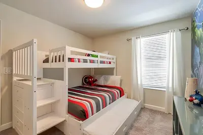 a white bunk bed in a childs bedroom at Casa 6Q c/ Piscina + Temas Disney – Storey Lake in Kissimmee