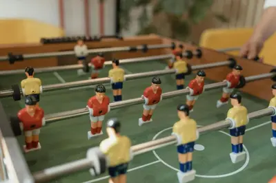 a group of toy men playing a table tennismatch at Magical Disney Getaway- Belle Potter & Minions in Kissimmee