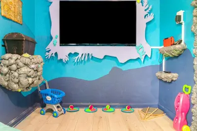 a room with a wall with a painting on it at Windsor Hills Family-Friendly 3BR Pool Townhome in Orlando