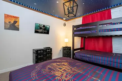 a bedroom with a bunk bed with a captain america mural at Casa 4Q c/ Piscina e Temas Mickey & Harry Potter in Kissimmee