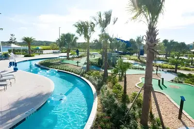 a pool at a resort with a water park at Villa 6Q Luxo c/ Piscina, Spa e Perto da Disney in Kissimmee