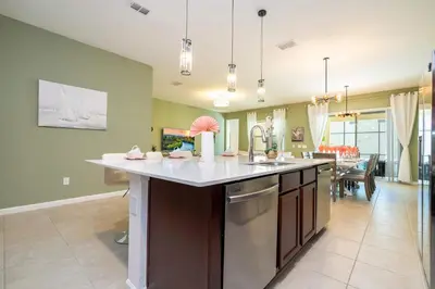 a kitchen with a large island in the middle at Family Friendly 12Bd w Jacuzzi Veranda Palms 4401 in Kissimmee