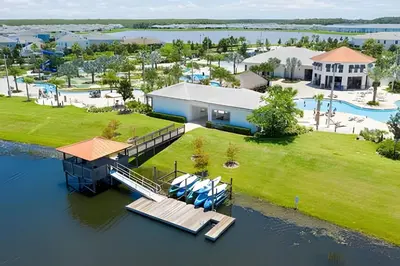 an aerial view of a house on the water at Casa 4Q Storey Lake c/ Piscina e Mickey in Kissimmee