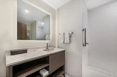 a bathroom with a sink and a shower at Comfort Inn & Suites Orlando Sanford Airport in Sanford