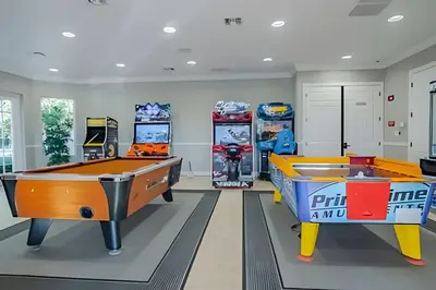 two ping pong tables in a gaming room with a pool at Apto 3Q Vista Cay Perto da Universal e OCCC in Orlando