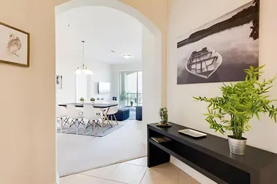 a dining room and living room with a table and chairs at Apto 3Q Vista Cay Perto da Universal e OCCC in Orlando