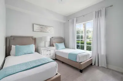 a bedroom with two beds and a window at Serene Disney Getaway Designer Style MP61 in Orlando