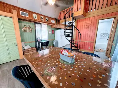 a dining room with a table with a basket on it at Pumba's Place - Fun, Lake, Pool- No Cleaning Fees! in Clermont