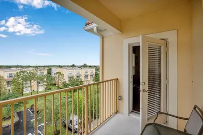 a balcony with a view of a building at Vista Cay Penthouse Luxury in Orlando