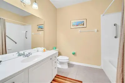 a bathroom with a white sink and a toilet at WOW Huge Stunner Corner in Orlando