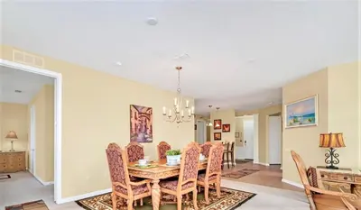 a dining room with a table and chairs at WOW Huge Stunner Corner in Orlando