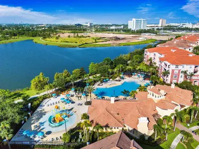 an aerial view of a resort with a pool at Lake & Pool View Fireworks in Orlando