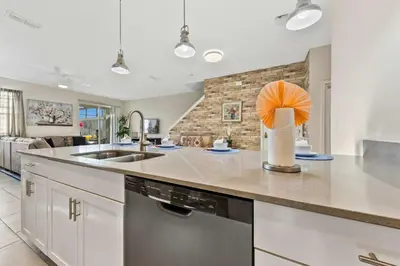 a kitchen with a sink and a counter top at Gorgeous 5Bd w Pool & Lazy River at Storey Lake 4989 in Kissimmee