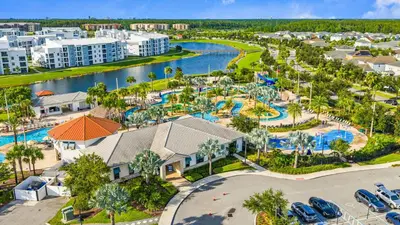 an aerial view of a resort with a pool at Gorgeous 5Bd w Pool & Lazy River at Storey Lake 4989 in Kissimmee