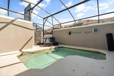 a swimming pool in the middle of a building at 5 Bedrooms 4 Bathrooms Storey Lake 4984Wa in Kissimmee
