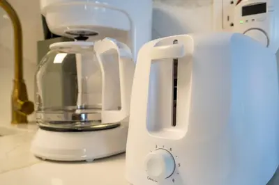 a white blender sitting on top of a counter at Studio with Private Terrace and Volcano Bay View Near Epic Universe in Orlando