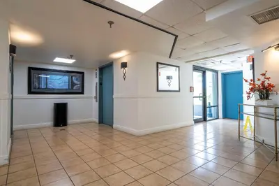 a large room with a large wall and a tile floor at Studio with Private Terrace and Volcano Bay View Near Epic Universe in Orlando