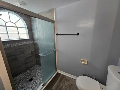 a bathroom with a shower and a toilet at 3beds 2baths Condo in Kissimmee, FL in Kissimmee