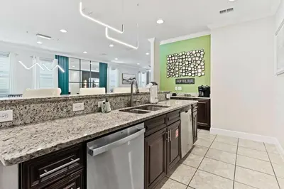 a kitchen with a sink and a counter top at Magical Memories Villa 10bd Near Disney in Orlando