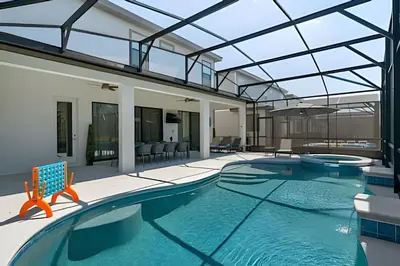an indoor swimming pool with a glass ceiling at Mansão 9Q Paradiso Grande. Piscina, Sala de Jogos in Orlando