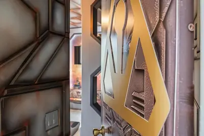 a door with a letter m on the side of it at 10min to Disney, Luxury 6BR Themed Villa with Private Pool,Spa and Game Room in Orlando