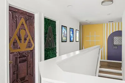a hallway with a door with a sign on it at 10min to Disney, Luxury 6BR Themed Villa with Private Pool,Spa and Game Room in Orlando