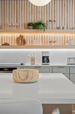 a kitchen with a counter with a wooden cutting board on it at 10min to Disney, Luxury 6BR Themed Villa with Private Pool,Spa and Game Room in Orlando