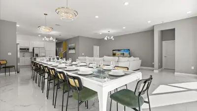 a large dining room with a long table and chairs at Upstay Veranda Palms Villa Pool Hot Tub & Games in Kissimmee