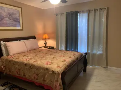 a bedroom with a bed and a window at Ortona's Best Kept Secret Three-Two Spacious Home in Orlando