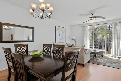 a dining room and living room with a table and chairs at Casa 3Q Vista Cay – Perto da Universal & Centro in Orlando