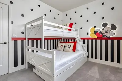 a white bunk bed in a room with black and white stripes at Casa 4Q Hidden Forest c/ Piscina in Orlando