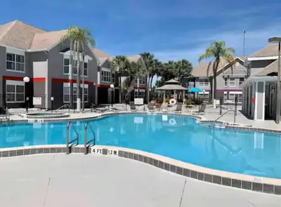 a large swimming pool at a resort at Mickey's Hideaway Condo Near Disney in Orlando
