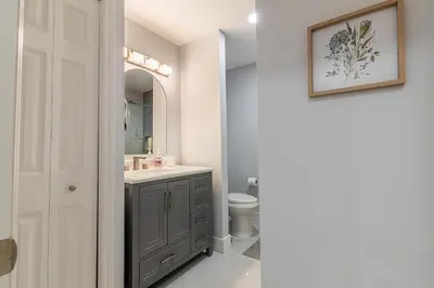 a bathroom with a sink and a toilet at Family-Friendly Apartment Near Disney & Universal in Kissimmee
