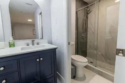 a bathroom with a sink and a toilet and a shower at Family-Friendly Apartment Near Disney & Universal in Kissimmee