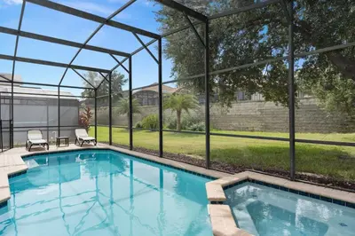 a swimming pool with a pergola and a house at Cozy Pool Villa Minutes Drive to Disney in Orlando