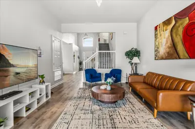 a living room with a couch and a table at Large Family Retreat Pool BBQ Disney Parks Nearby in Orlando
